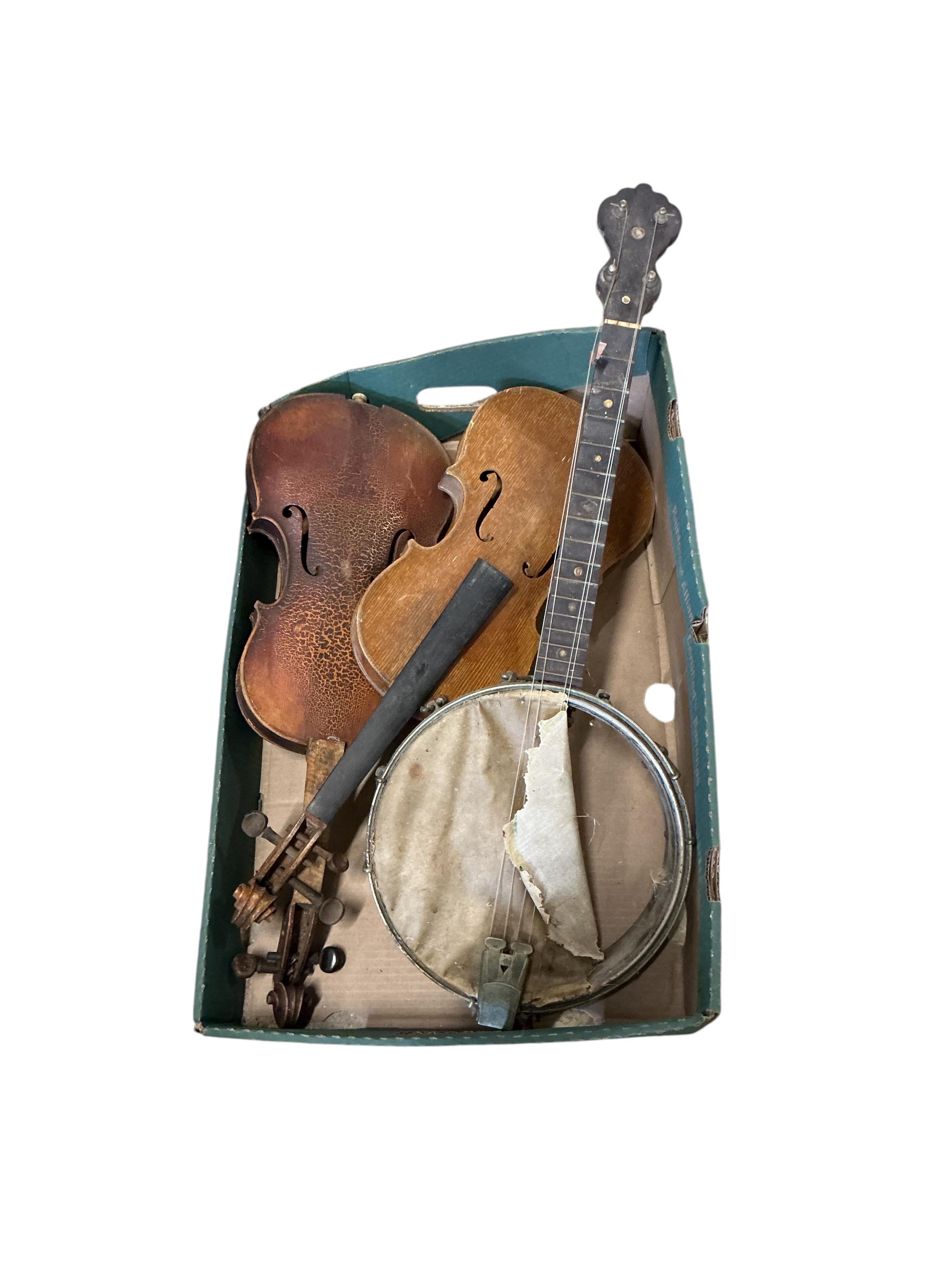 A small cello and assorted instruments in need of restoration